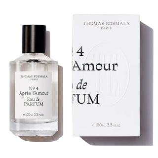 Botella elegante de apres l amour de Thomas Kosmala Paris, con un diseño minimalista en blanco y un tapón negro, presentada junto a su caja