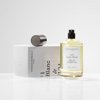 Botella sofisticada de N. 1 Tonic Blanc Thomas Kosmala, con un diseño blanco limpio y un tapón negro elegante, destacando la fresca y distintiva fragancia.