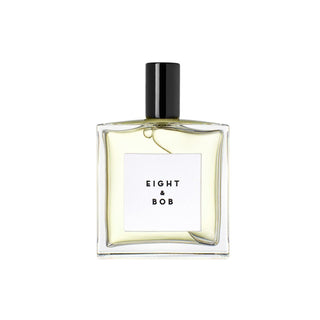 Botella elegante de perfume Eight and Bob Original, con un diseño minimalista en tonos ámbar y un tapón negro.
